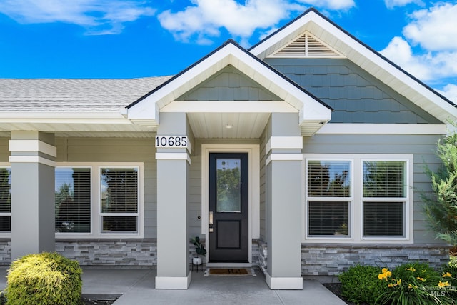 10685 W Evelia St, Boise, ID 83709 - property entrance with stone siding and roof with shingles
