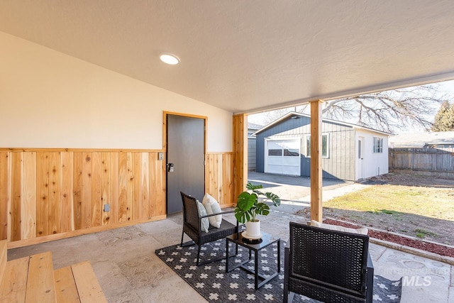 view of patio / terrace featuring an outbuilding and a garage