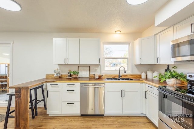 kitchen with white cabinets and stainless steel appliances