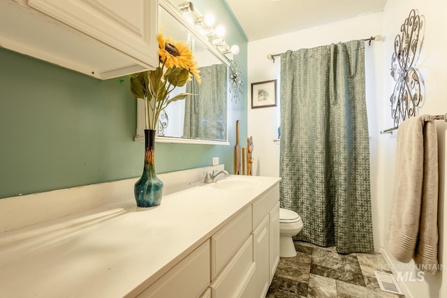 bathroom with vanity and toilet