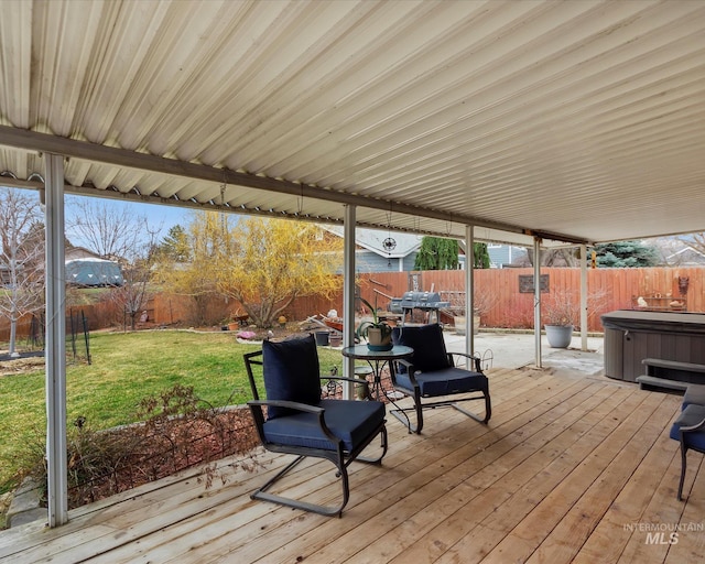 deck with a lawn, a grill, a fenced backyard, and a hot tub