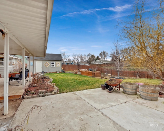 view of patio / terrace featuring a fenced backyard and an outdoor structure