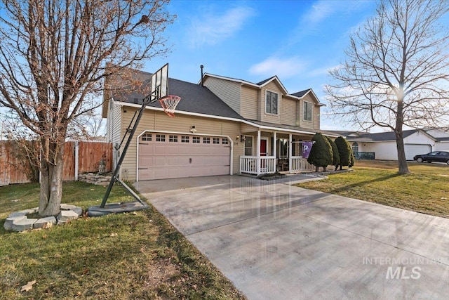 view of front of property with covered porch, a front yard, and a garage