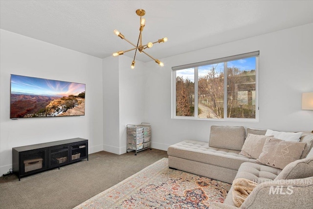 living area featuring baseboards, carpet floors, and a chandelier