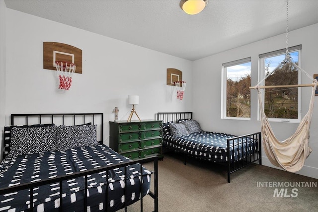 carpeted bedroom with a textured ceiling