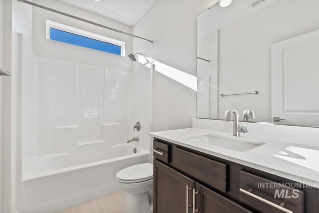 full bathroom featuring vanity, shower / bathtub combination, and toilet