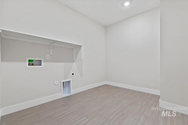 washroom with hookup for a washing machine, gas dryer hookup, hookup for an electric dryer, and light hardwood / wood-style floors