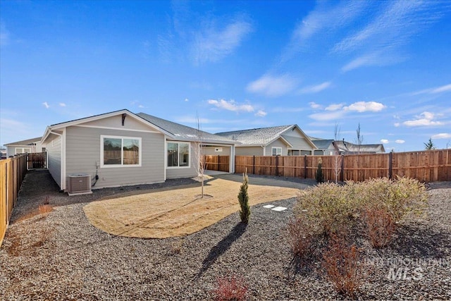 rear view of house featuring a patio and cooling unit