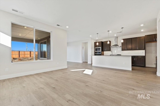 unfurnished living room with light wood-type flooring