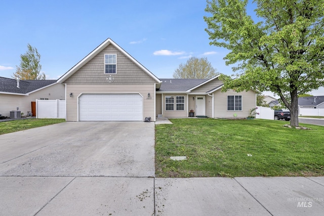 1517 Elm St N, Jerome, ID 83338 - view of front of property featuring concrete driveway, a garage, and central AC unit