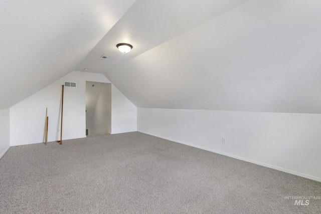 1517 Elm St N, Jerome, ID 83338 - additional living space with vaulted ceiling, carpet floors, and baseboards