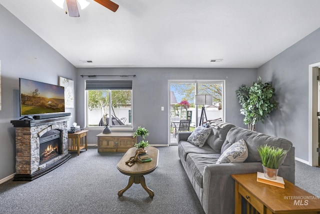 1517 Elm St N, Jerome, ID 83338 - carpeted living room with a ceiling fan, baseboards, and a stone fireplace