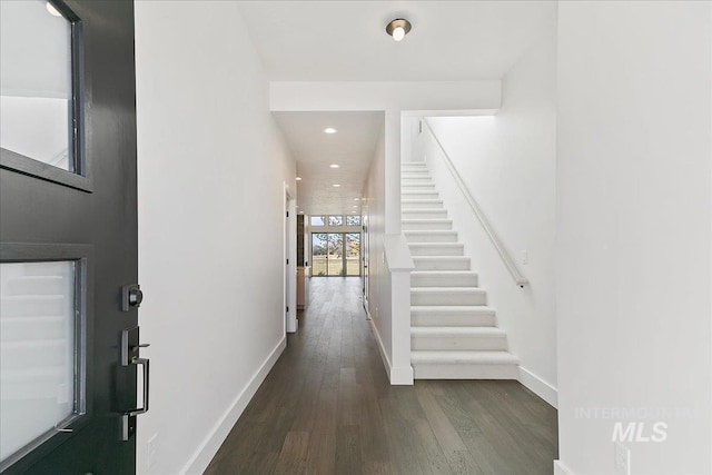 entryway featuring stairs, baseboards, wood finished floors, and recessed lighting