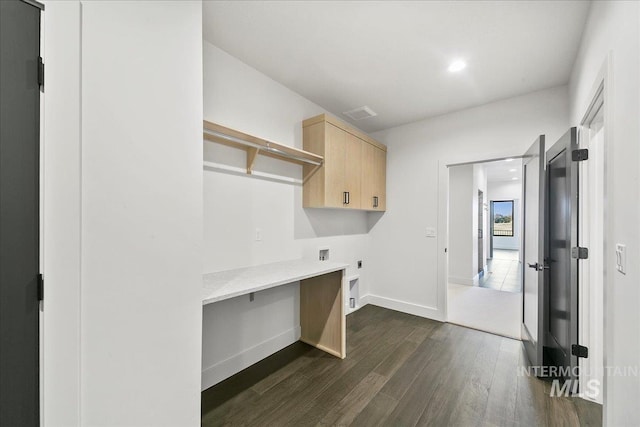 laundry room with cabinet space, baseboards, dark wood finished floors, hookup for an electric dryer, and washer hookup