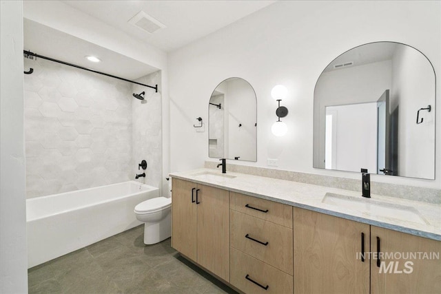 bathroom featuring visible vents, a sink, and toilet