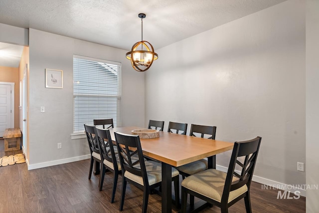 1873 W American Fork Dr, Meridian, ID 83642 - dining space with dark wood-style floors, baseboards, a chandelier, and a textured ceiling