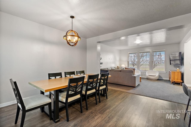 1873 W American Fork Dr, Meridian, ID 83642 - dining room with wood finished floors, a chandelier, baseboards, and a textured ceiling
