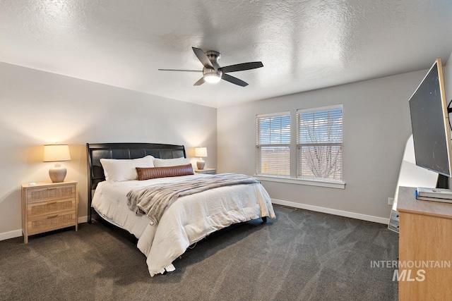 1873 W American Fork Dr, Meridian, ID 83642 - bedroom with dark colored carpet, baseboards, and ceiling fan