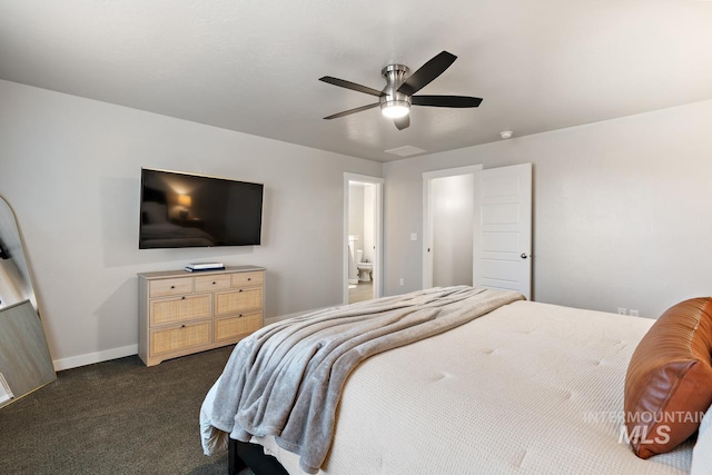 1873 W American Fork Dr, Meridian, ID 83642 - bedroom with dark colored carpet, baseboards, ceiling fan, and ensuite bath