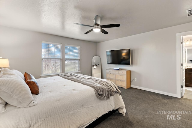 1873 W American Fork Dr, Meridian, ID 83642 - bedroom featuring dark colored carpet, baseboards, ensuite bathroom, and ceiling fan