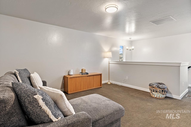 1873 W American Fork Dr, Meridian, ID 83642 - living area with dark colored carpet, baseboards, and a chandelier