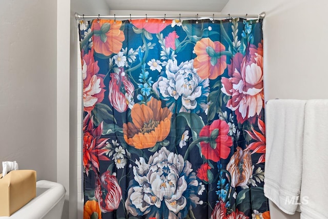 1873 W American Fork Dr, Meridian, ID 83642 - bathroom with curtained shower and toilet