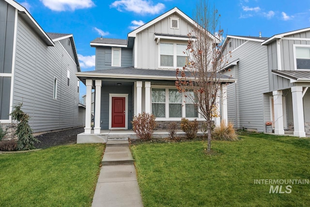 1873 W American Fork Dr, Meridian, ID 83642 - view of front of property with board and batten siding, a porch, and a front lawn
