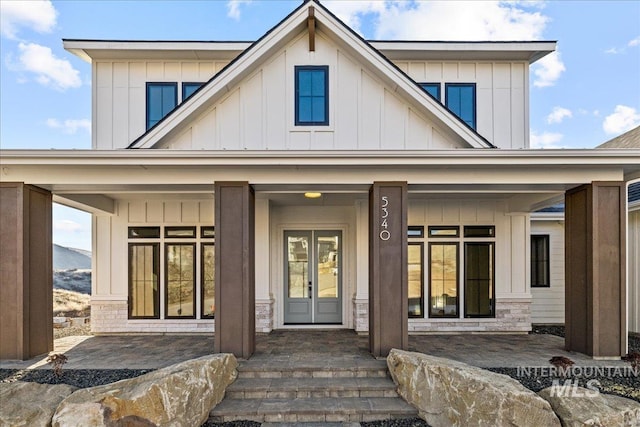 back of property featuring a porch