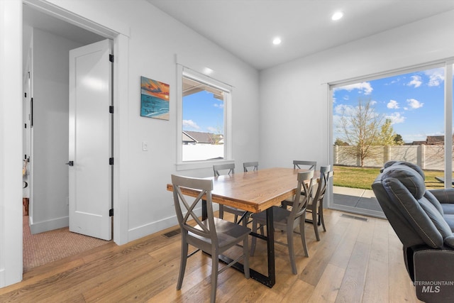 dining area featuring light wood-style floors, recessed lighting, visible vents, and baseboards