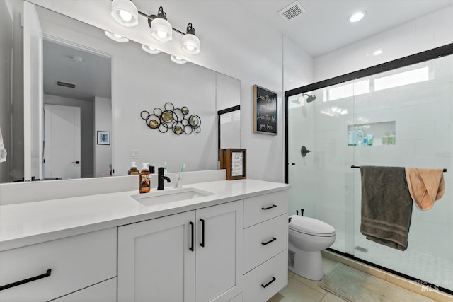 bathroom with visible vents, a shower stall, and toilet