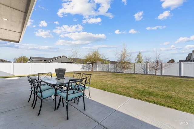 view of patio featuring outdoor dining area and a fenced backyard
