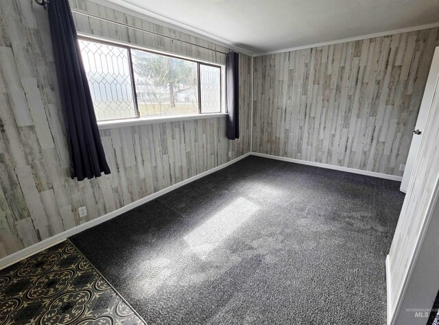 522 Ellis Ave, Winchester, ID 83555 - spare room with wood walls and baseboards