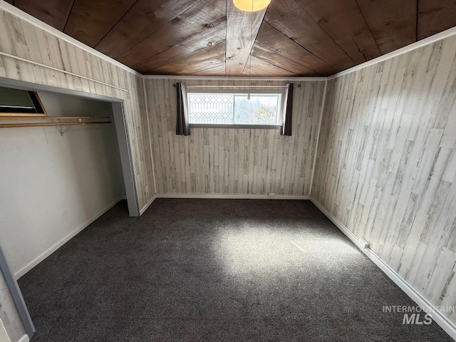 522 Ellis Ave, Winchester, ID 83555 - unfurnished bedroom with wood ceiling, wooden walls, carpet flooring, and baseboards