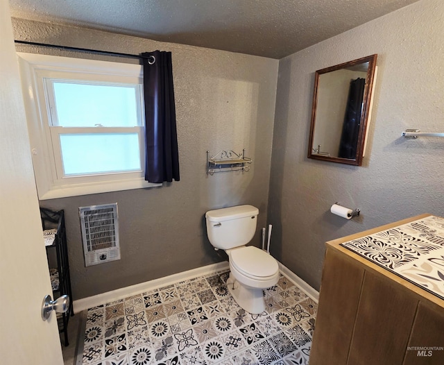 522 Ellis Ave, Winchester, ID 83555 - half bath featuring heating unit, toilet, and baseboards