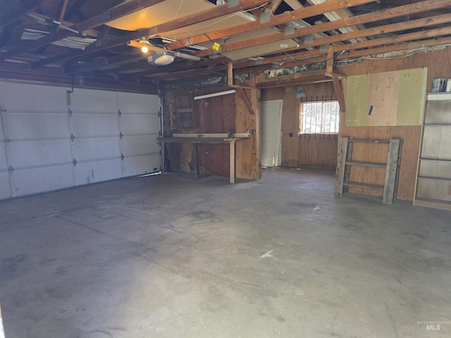 522 Ellis Ave, Winchester, ID 83555 - garage featuring a garage door opener and wooden walls