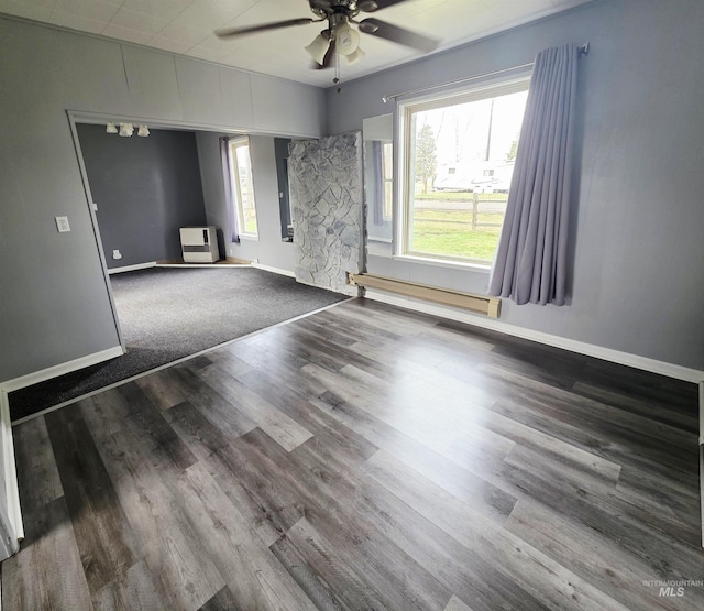 522 Ellis Ave, Winchester, ID 83555 - unfurnished room with ceiling fan, a baseboard radiator, dark wood finished floors, and baseboards
