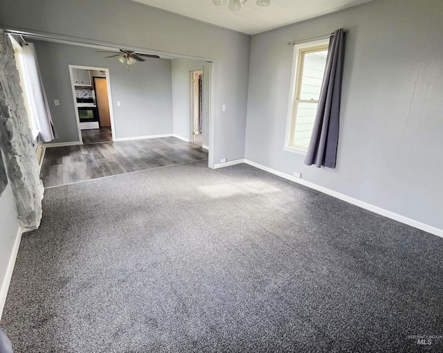 522 Ellis Ave, Winchester, ID 83555 - spare room with dark colored carpet, ceiling fan, and baseboards