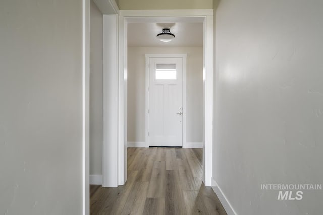 hall with light hardwood / wood-style flooring