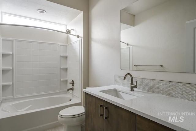 full bathroom featuring backsplash, shower / washtub combination, vanity, and toilet