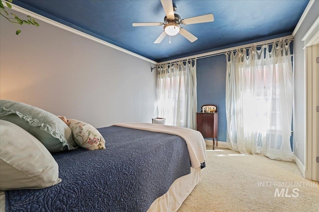2260 N Eagle Creek Ln, Eagle, ID 83616 - bedroom with carpet, baseboards, a ceiling fan, and ornamental molding
