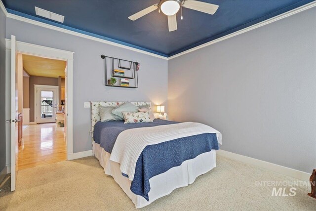 2260 N Eagle Creek Ln, Eagle, ID 83616 - carpeted bedroom with baseboards, ornamental molding, and ceiling fan