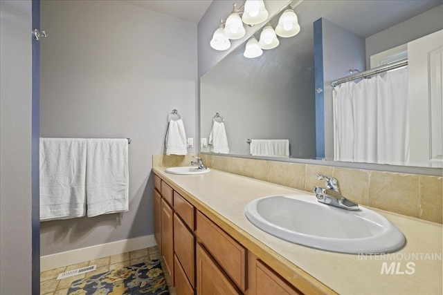 2260 N Eagle Creek Ln, Eagle, ID 83616 - bathroom featuring baseboards, double vanity, and a shower with curtain