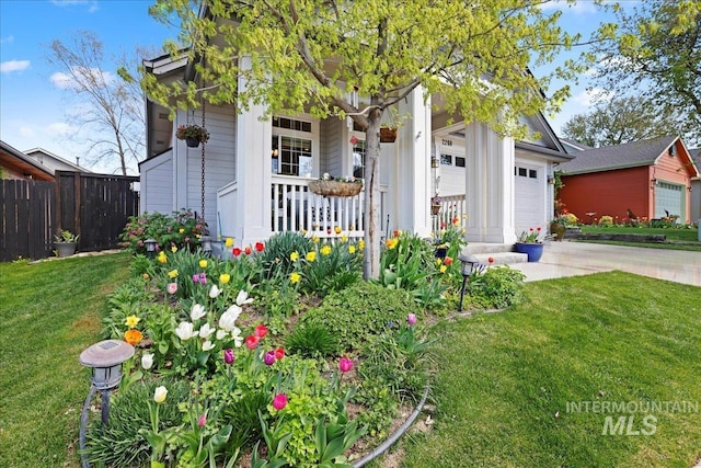 2260 N Eagle Creek Ln, Eagle, ID 83616 - view of front of house featuring a porch, concrete driveway, and a garage