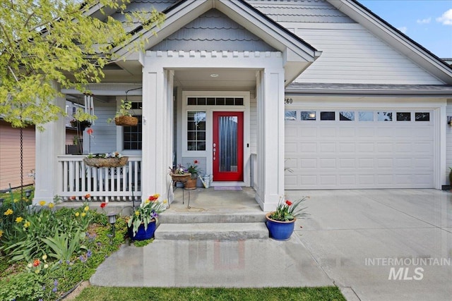 2260 N Eagle Creek Ln, Eagle, ID 83616 - view of exterior entry featuring a porch, an attached garage, and concrete driveway