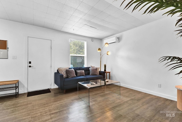 living room featuring baseboards, dark wood-style flooring, and a wall mounted air conditioner