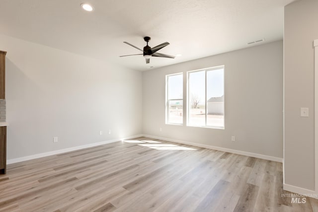 4435 N Magical Creek Ave, Meridian, ID 83646 - unfurnished living room featuring a ceiling fan, recessed lighting, baseboards, visible vents, and light wood-style floors