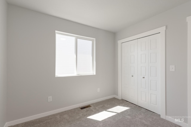 4435 N Magical Creek Ave, Meridian, ID 83646 - unfurnished bedroom with carpet, baseboards, a closet, and visible vents