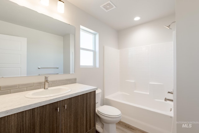 4435 N Magical Creek Ave, Meridian, ID 83646 - bathroom with toilet, visible vents, vanity, bathing tub / shower combination, and tasteful backsplash