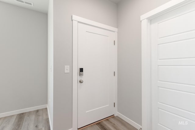 4435 N Magical Creek Ave, Meridian, ID 83646 - doorway to outside with light wood-type flooring, baseboards, and visible vents