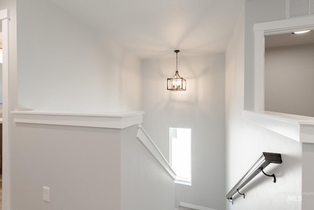 4435 N Magical Creek Ave, Meridian, ID 83646 - stairway with a notable chandelier and visible vents